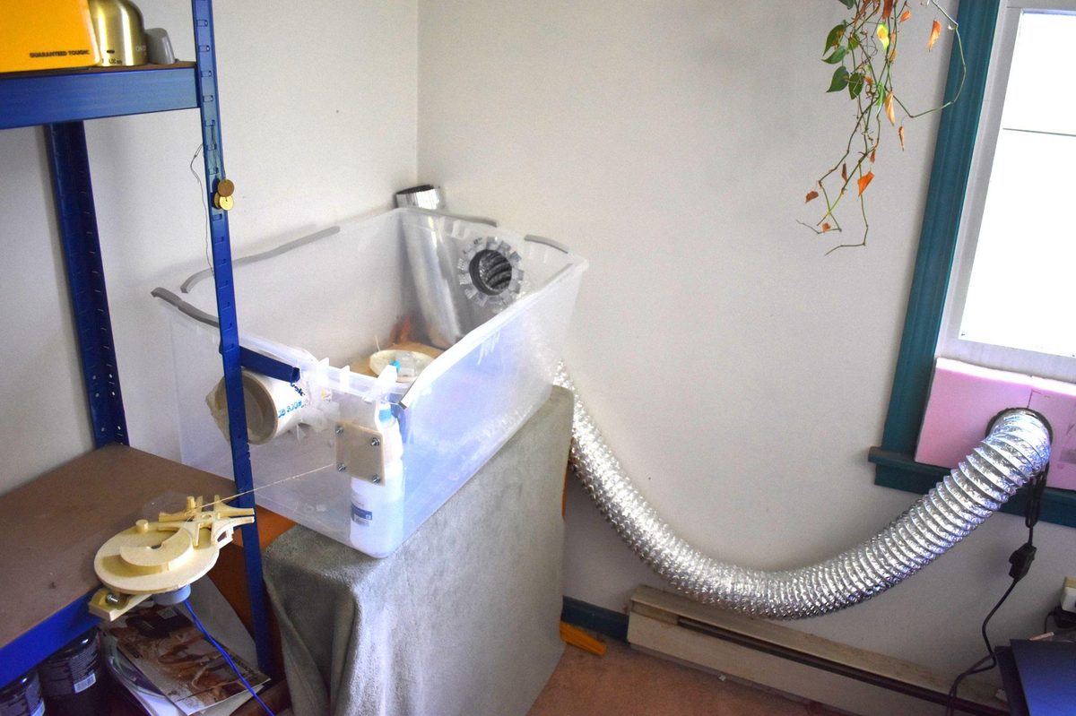 Geneva mechanism mounted in grow space with exterior exhaust duct