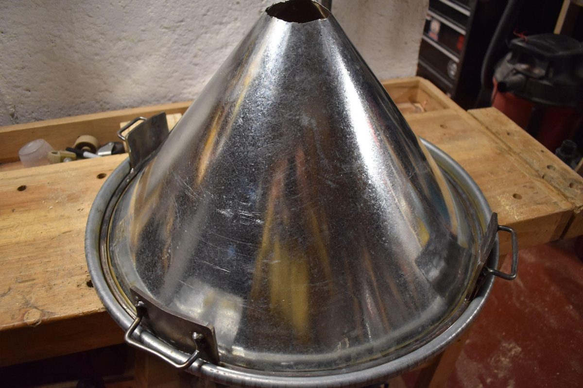 Hand-fabricated funnel assembly with strap sealing handles
